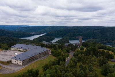 High angle view of buildings against cloudy sky