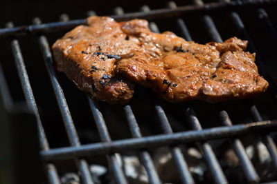 Close-up of meat on barbecue grill