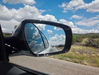 Reflection of car on side-view mirror