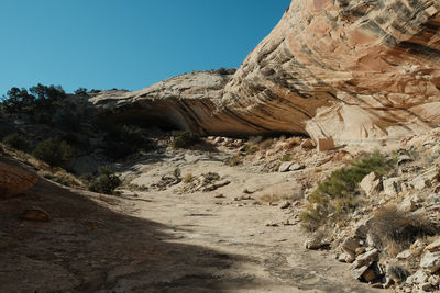 Rock formations on landscape against sky