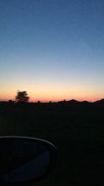 Scenic view of silhouette landscape against clear sky during sunset