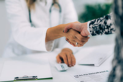 Handshake after signing medical data form