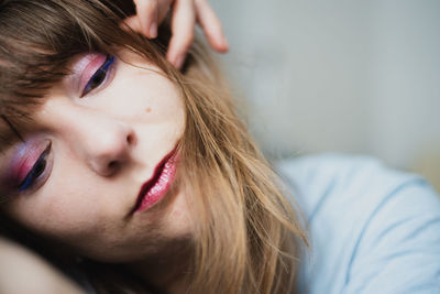 Close-up portrait of beautiful woman at home