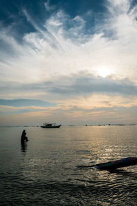 Scenic view of sea at sunset