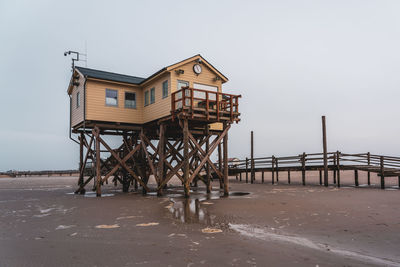 Pile dwelling on the beach of sankt peter-ording in germany.