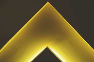 Low angle view of yellow structure against sky