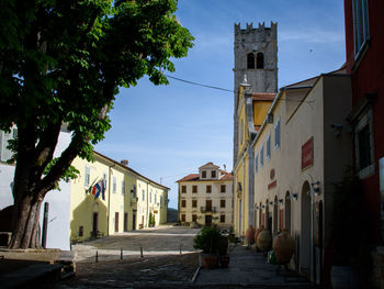 Motovun squate amidst buildings against sky