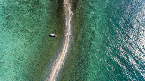 High angle view of boat on sea shore