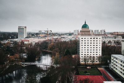 Buildings in city against sky