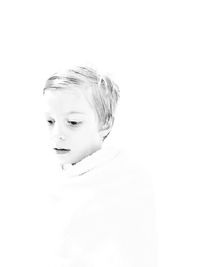 Close-up of girl against white background