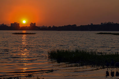 Scenic view of sunset over city