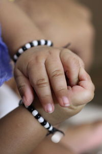 Close-up of woman holding hands