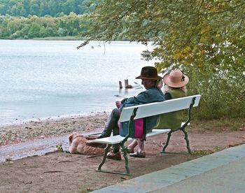 Men sitting on shore