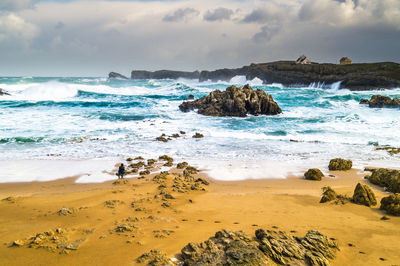 Scenic view of beach against sky