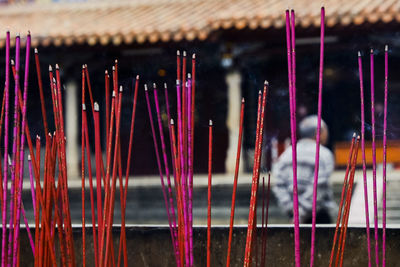 Close-up of candles against building