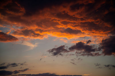 Low angle view of dramatic sky during sunset