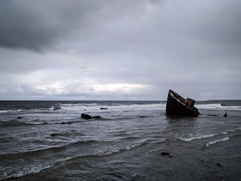 Boat on sea against sky