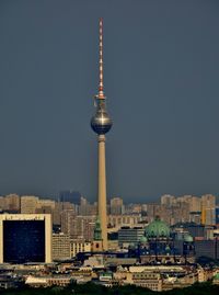 Communications tower in city against clear sky, berlin panorama mit fernsehturm.
