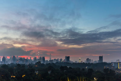 Cityscape against sky during sunset