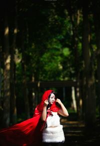 Close-up of woman standing in forest