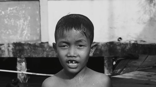 Portrait of shirtless boy in water