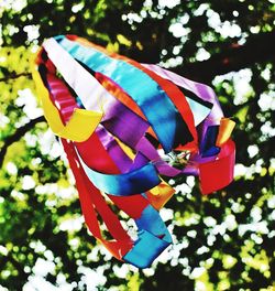 Close-up of multi colored toy hanging on tree