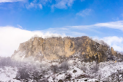 Scenic view of rock formation against sky