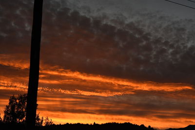 Low angle view of dramatic sky at sunset