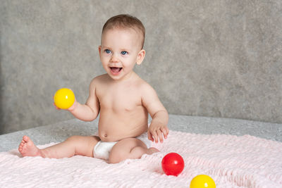 Portrait of cute boy playing with toy