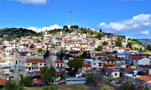 Houses in town against sky