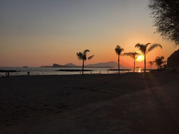 Scenic view of beach at sunset