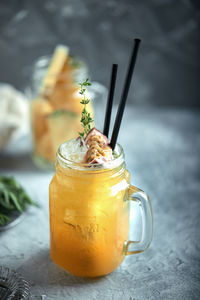 Close-up of drink in glass jar on table