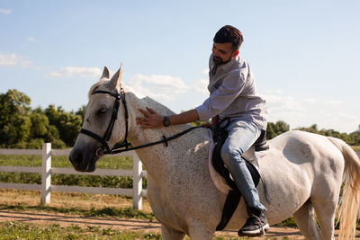 Man riding horse