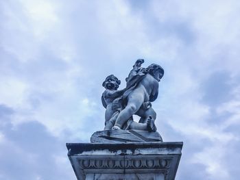 Low angle view of statue against sky