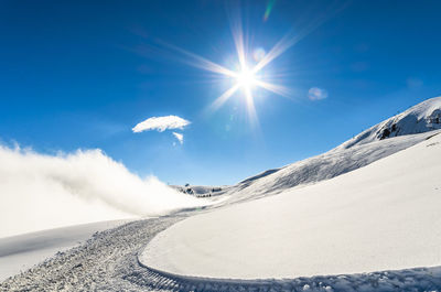 Scenic view of mountains against sky during winter