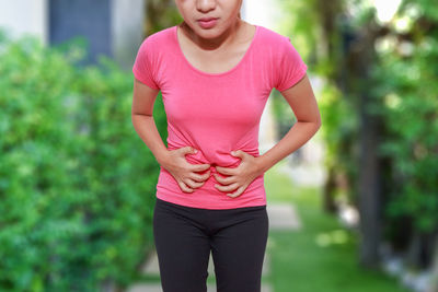 Midsection of woman suffering from stomachache