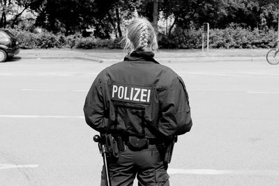 Rear view of man standing on street