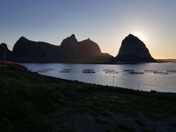 Scenic view of sea against clear sky during sunset