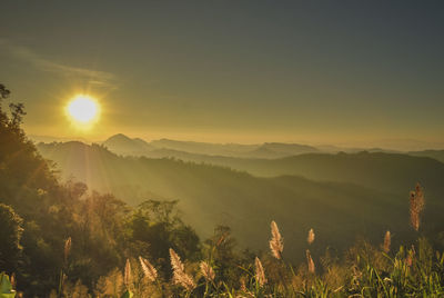 Scenic view of mountains against sky during sunset