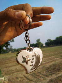 Close-up of hand holding heart shape