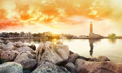 Rocks in city during sunset