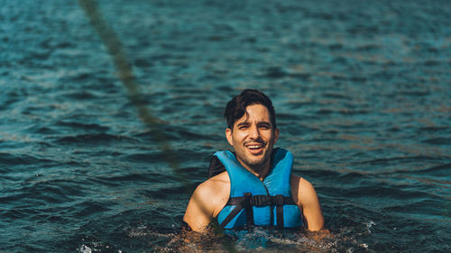 Portrait of young man in sea