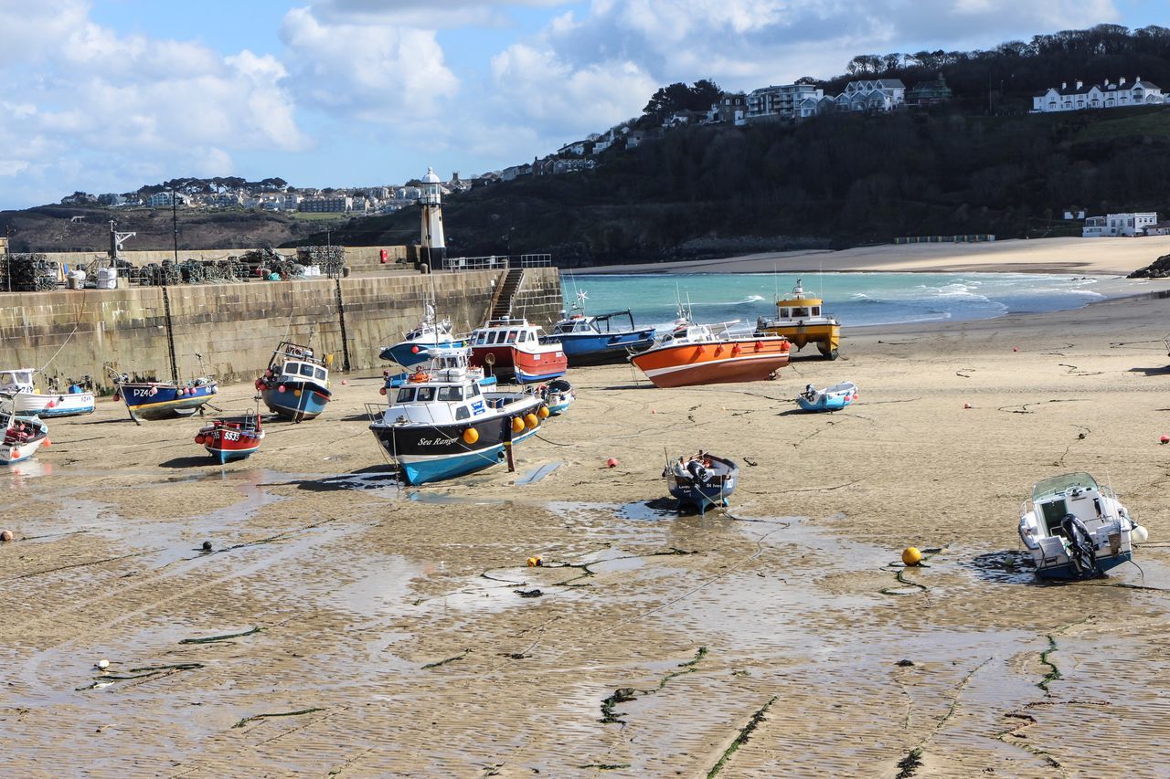 transportation, beach, nautical vessel, mode of transport, outdoors, no people, mountain, nature, day, sky, architecture