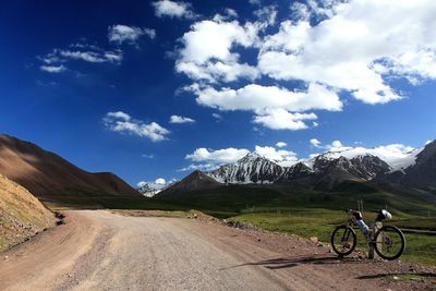 Bicycles on mountain against sky