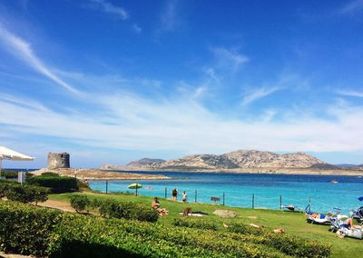 Scenic view of beach against blue sky