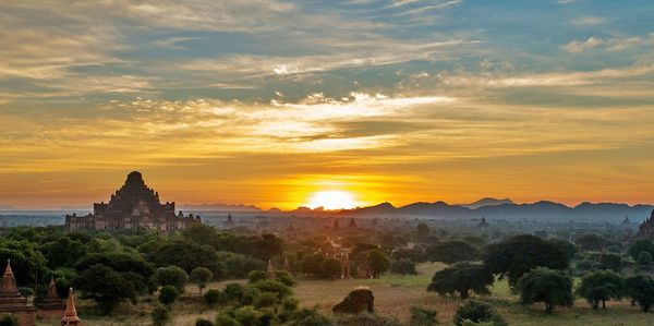 Panoramic view of buildings against sky during sunset