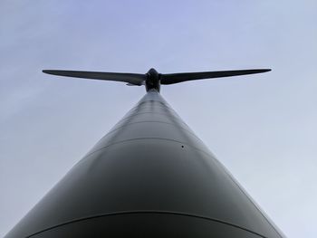 Low angle view of wind turbine against sky