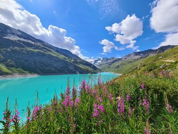 Scenic view of lake against cloudy sky