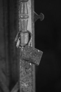 Close-up of rusty chain hanging on metal