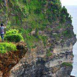 Man standing on cliff